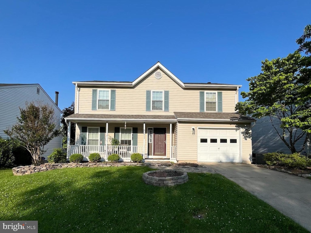 5553 Sponseller Ct, New Market, MD 21774 - traditional-style house featuring covered porch, driveway, a front yard, and an attached garage