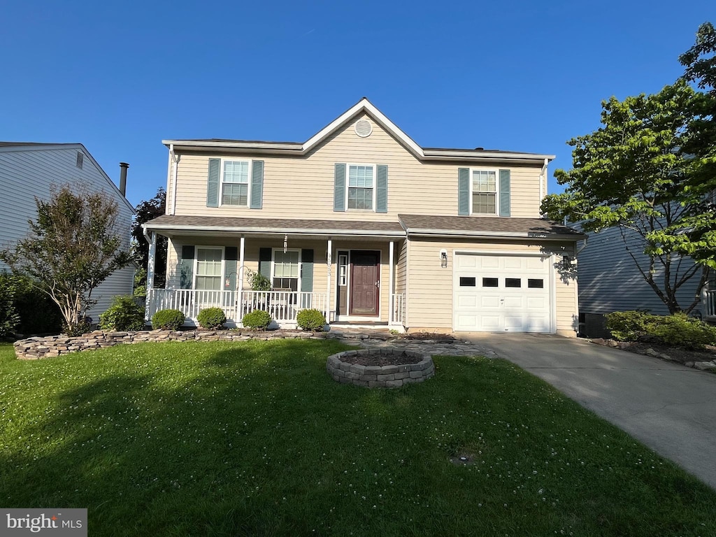 5553 Sponseller Ct, New Market, MD 21774 - traditional-style home featuring a porch, driveway, a front lawn, and an attached garage