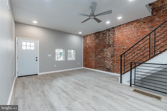 5229 Webster St, Philadelphia, PA 19143 - unfurnished living room with ceiling fan, baseboards, wood finished floors, brick wall, and recessed lighting