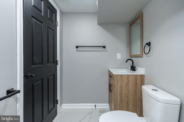 5229 Webster St, Philadelphia, PA 19143 - bathroom featuring toilet, vanity, marble finish flooring, and baseboards
