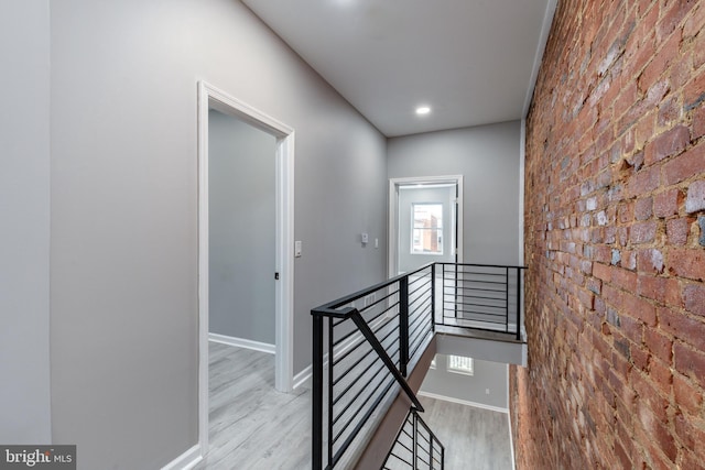 5229 Webster St, Philadelphia, PA 19143 - hallway featuring an upstairs landing, wood finished floors, and baseboards
