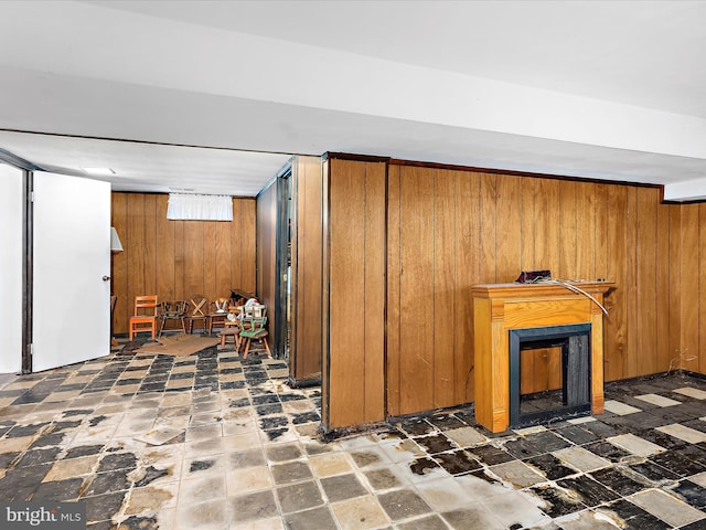 435 Yellow Spgs S, Laurel, MD 20724 - below grade area featuring wooden walls and a fireplace