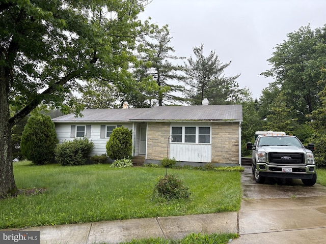 435 Yellow Spgs S, Laurel, MD 20724 - single story home with stone siding, a chimney, a front yard, and metal roof