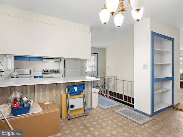 435 Yellow Spgs S, Laurel, MD 20724 - kitchen with white appliances, under cabinet range hood, a chandelier, a peninsula, and light countertops