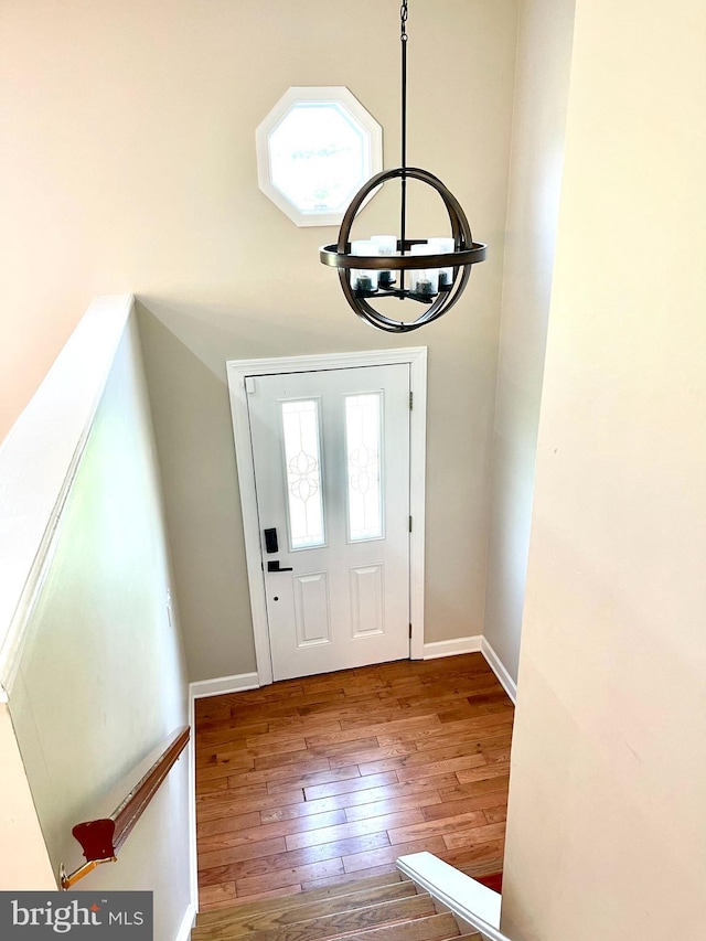 25795 Shamrock Ln, Mechanicsville, MD 20659 - entryway featuring a chandelier, hardwood / wood-style floors, and baseboards