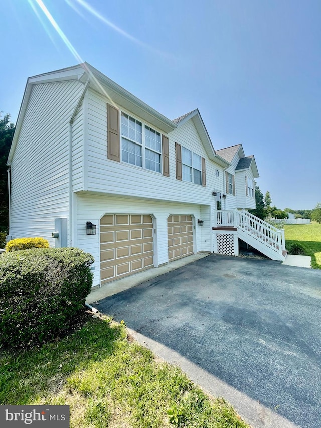 25795 Shamrock Ln, Mechanicsville, MD 20659 - view of side of property with asphalt driveway and a garage