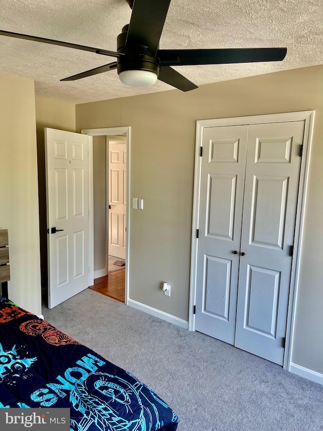25795 Shamrock Ln, Mechanicsville, MD 20659 - unfurnished bedroom with a textured ceiling, carpet, a ceiling fan, and baseboards