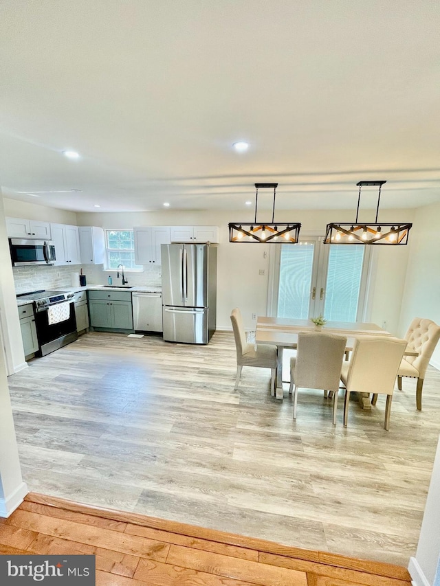 25795 Shamrock Ln, Mechanicsville, MD 20659 - dining area with light wood-type flooring and recessed lighting