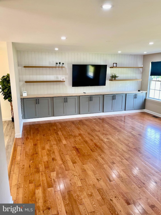 25795 Shamrock Ln, Mechanicsville, MD 20659 - unfurnished living room with hardwood / wood-style flooring, baseboards, and recessed lighting