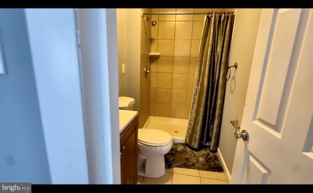 1707 Harman Ave, Baltimore, MD 21230 - full bathroom with toilet, tile patterned flooring, a stall shower, and vanity