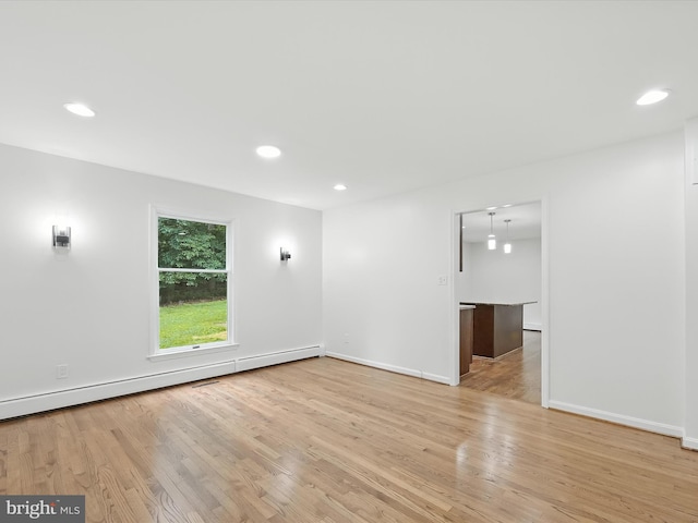 2500 Sams Creek Rd, Westminster, MD 21157 - empty room with light wood-style floors, a baseboard heating unit, and recessed lighting