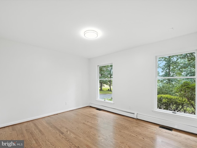 2500 Sams Creek Rd, Westminster, MD 21157 - spare room featuring a baseboard heating unit and wood finished floors