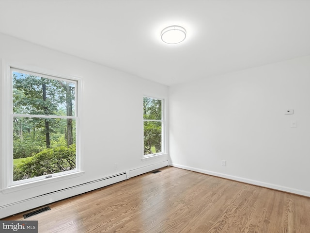 2500 Sams Creek Rd, Westminster, MD 21157 - spare room featuring a baseboard radiator and wood finished floors