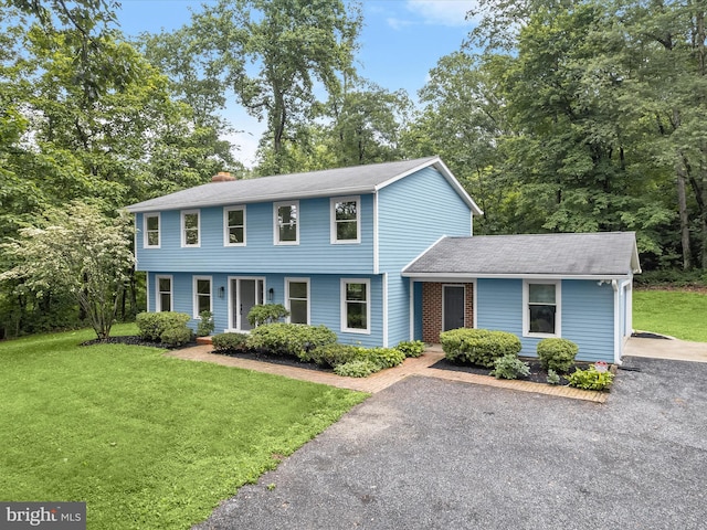2500 Sams Creek Rd, Westminster, MD 21157 - colonial home with a front lawn, a chimney, and roof with shingles