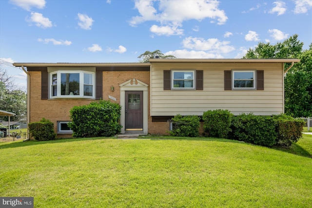 10520 Truxton Rd, Hyattsville, MD 20783 - bi-level home featuring a front yard and brick siding