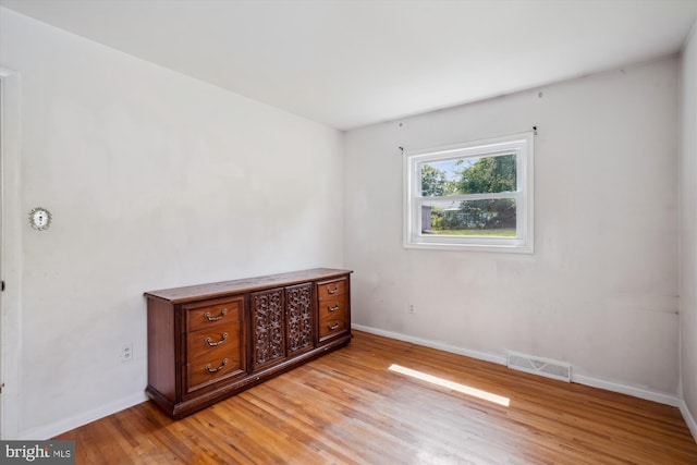 10520 Truxton Rd, Hyattsville, MD 20783 - unfurnished bedroom featuring light wood-type flooring and baseboards