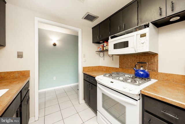 309 Florence Ave Unit 420-N, Jenkintown, PA 19046 - kitchen featuring white appliances, light countertops, light tile patterned flooring, and open shelves