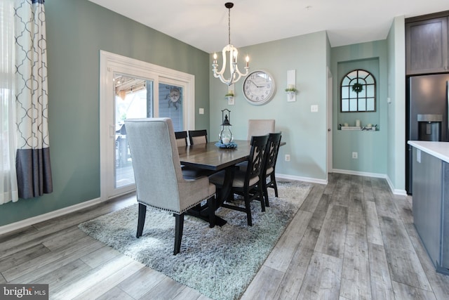 2017 Chamberlain Dr, Frederick, MD 21702 - dining space featuring a chandelier, light wood-type flooring, and baseboards