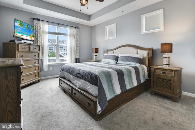 2017 Chamberlain Dr, Frederick, MD 21702 - carpeted bedroom featuring baseboards, a tray ceiling, and ceiling fan