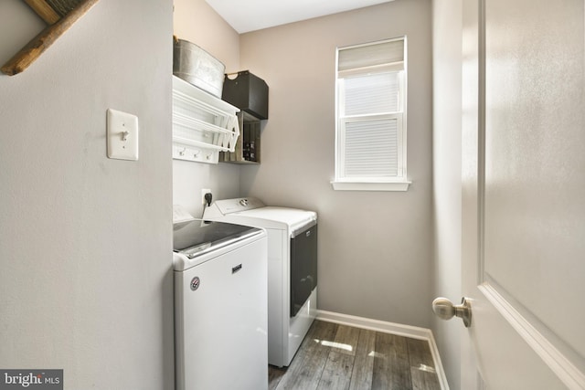 2017 Chamberlain Dr, Frederick, MD 21702 - laundry area featuring washer and dryer, wood finished floors, and baseboards