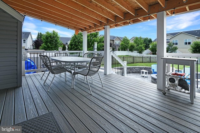 2017 Chamberlain Dr, Frederick, MD 21702 - wooden terrace featuring outdoor dining area, a fenced backyard, and a residential view