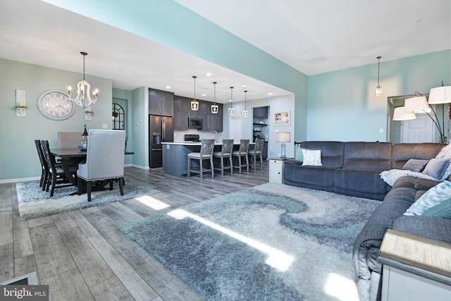 2017 Chamberlain Dr, Frederick, MD 21702 - living area featuring light wood-style flooring, a chandelier, recessed lighting, and baseboards
