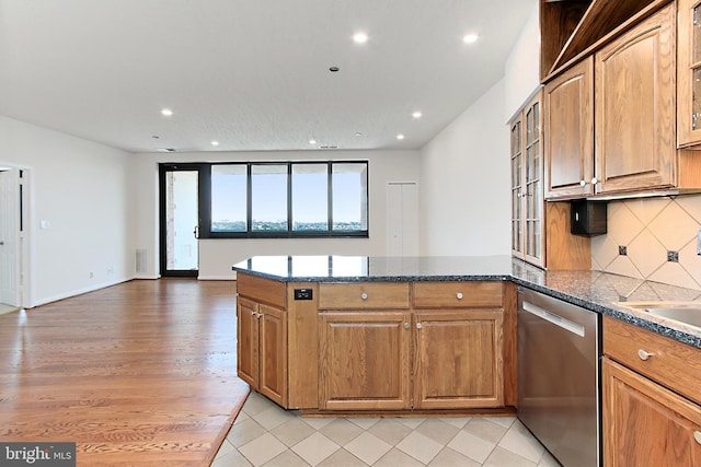 1805 Crystal Dr Unit 1110S, Arlington, VA 22202 - kitchen with stainless steel dishwasher, a peninsula, recessed lighting, tasteful backsplash, and dark stone countertops
