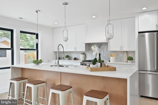 4324 Yuma St NW, Washington, DC 20016 - kitchen with freestanding refrigerator, a sink, decorative backsplash, white cabinets, and recessed lighting