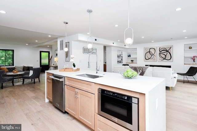 4324 Yuma St NW, Washington, DC 20016 - kitchen with open floor plan, a sink, stainless steel dishwasher, light brown cabinetry, and recessed lighting