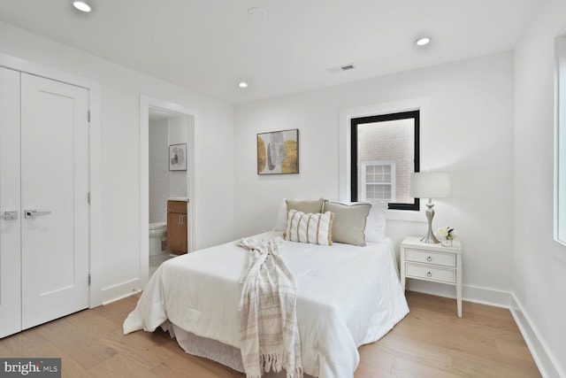 4324 Yuma St NW, Washington, DC 20016 - bedroom with light wood-style floors, baseboards, connected bathroom, recessed lighting, and multiple windows