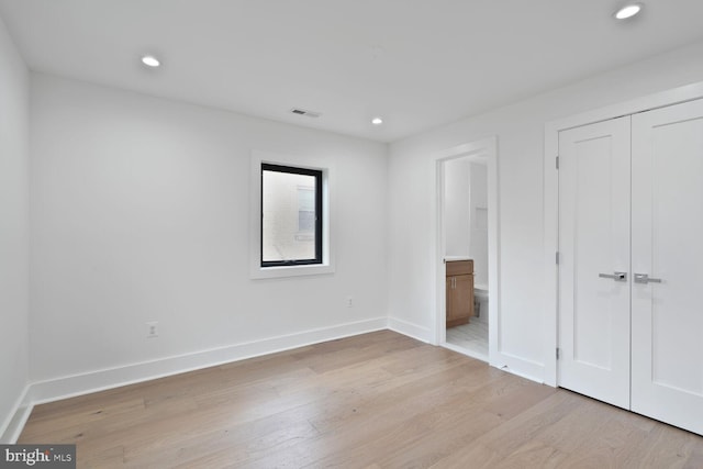 4324 Yuma St NW, Washington, DC 20016 - unfurnished bedroom featuring light wood-type flooring, baseboards, recessed lighting, a closet, and connected bathroom