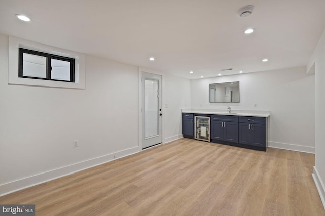 4324 Yuma St NW, Washington, DC 20016 - indoor wet bar featuring beverage cooler, light wood finished floors, baseboards, and recessed lighting