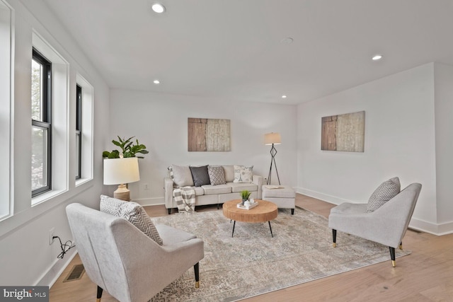 4324 Yuma St NW, Washington, DC 20016 - living room with plenty of natural light, baseboards, recessed lighting, and wood finished floors