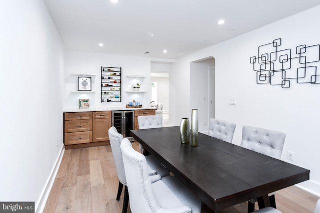4324 Yuma St NW, Washington, DC 20016 - dining space featuring bar, wine cooler, light wood-style floors, recessed lighting, and baseboards
