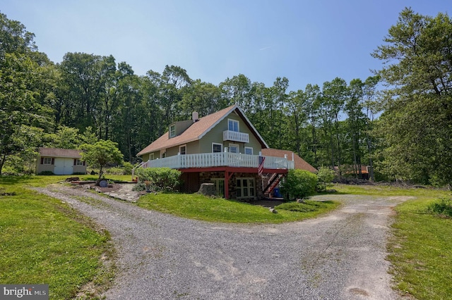 402 Swamp Rd, Morgantown, PA 19543 - view of front of property featuring a deck, dirt driveway, a front lawn, stairway, and a chimney