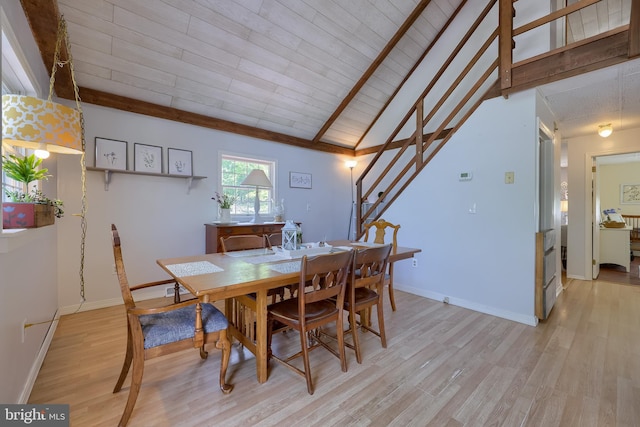 402 Swamp Rd, Morgantown, PA 19543 - dining room with light wood-type flooring, beam ceiling, baseboards, and stairs