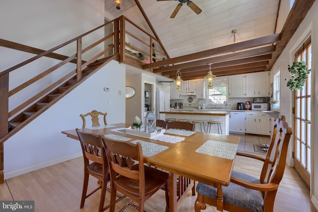 402 Swamp Rd, Morgantown, PA 19543 - dining area with a ceiling fan, light wood-style floors, wooden ceiling with exposed beams, high vaulted ceiling, and stairway