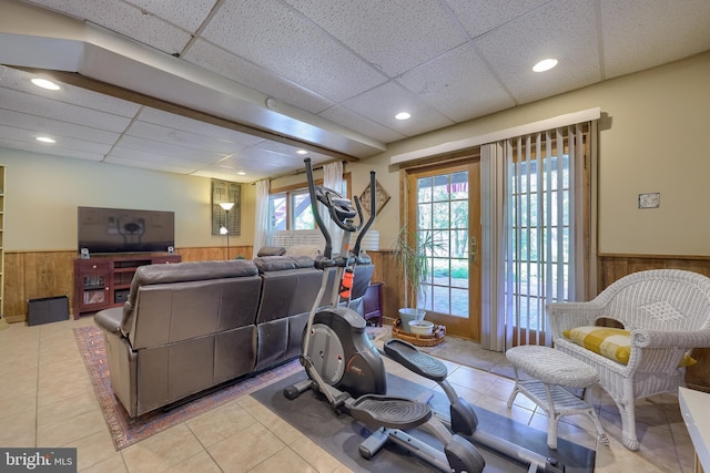 402 Swamp Rd, Morgantown, PA 19543 - workout room featuring a wainscoted wall, a paneled ceiling, wooden walls, and light tile patterned flooring