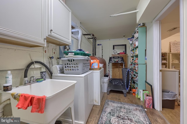 402 Swamp Rd, Morgantown, PA 19543 - laundry area with cabinet space, washing machine and dryer, and light wood-style floors