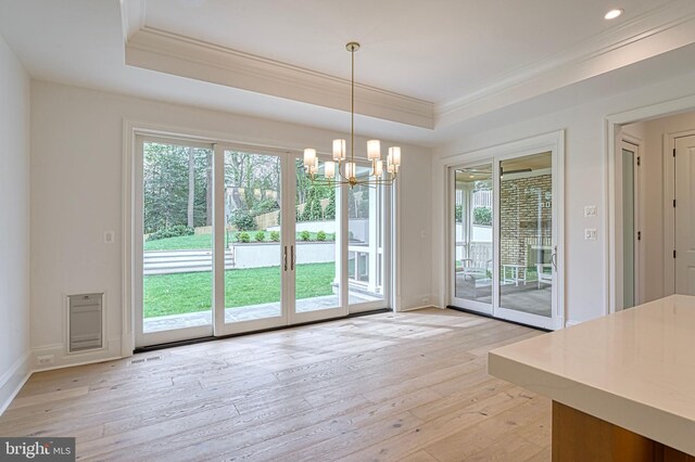 4740 34th Rd N, Arlington, VA 22207 - unfurnished dining area with crown molding, a raised ceiling, a chandelier, light wood-type flooring, and baseboards
