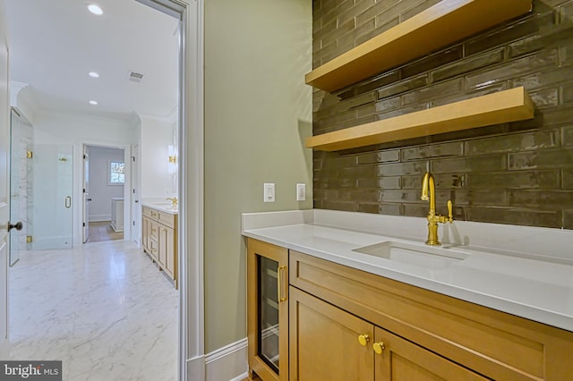 4740 34th Rd N, Arlington, VA 22207 - bar with a sink, backsplash, ornamental molding, light marble finish flooring, and baseboards