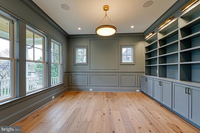 4740 34th Rd N, Arlington, VA 22207 - spare room featuring ornamental molding, light wood finished floors, and a decorative wall