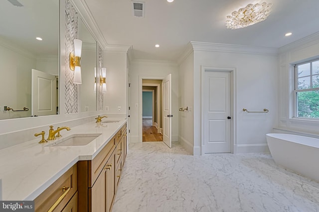 4740 34th Rd N, Arlington, VA 22207 - bathroom with marble tiled floors, double vanity, a freestanding tub, ornamental molding, and recessed lighting