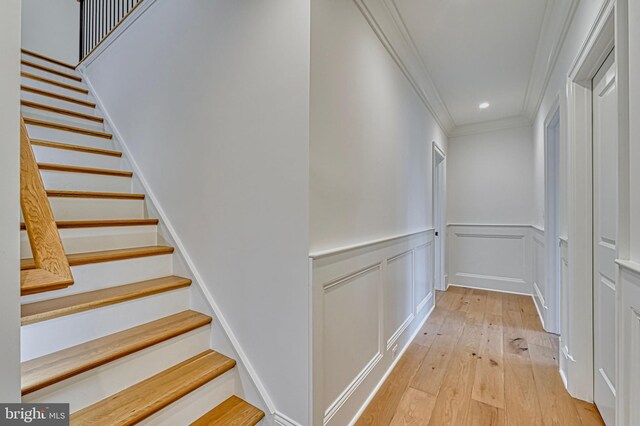 4740 34th Rd N, Arlington, VA 22207 - stairway with crown molding, hardwood / wood-style flooring, wainscoting, recessed lighting, and a decorative wall