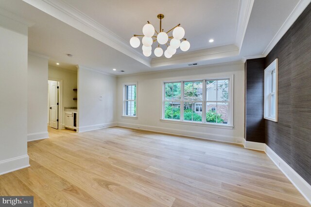 4740 34th Rd N, Arlington, VA 22207 - spare room with ornamental molding, baseboards, a tray ceiling, a chandelier, and light wood-style floors
