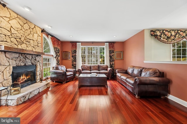 6 Keystone Way, Princeton Junction, NJ 08550 - living room featuring healthy amount of natural light, a fireplace, dark wood finished floors, and baseboards