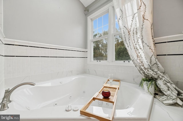 6 Keystone Way, Princeton Junction, NJ 08550 - bathroom featuring a tub with jets and a wainscoted wall