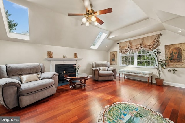 6 Keystone Way, Princeton Junction, NJ 08550 - living room featuring a skylight, lofted ceiling, wood-type flooring, ceiling fan, and a lit fireplace