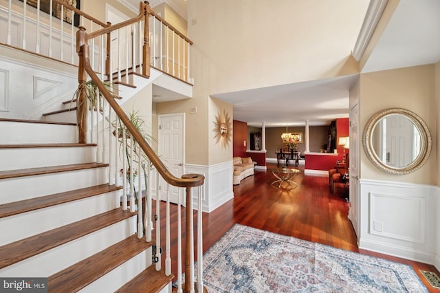 6 Keystone Way, Princeton Junction, NJ 08550 - entryway with wood finished floors, wainscoting, stairs, a decorative wall, and a high ceiling