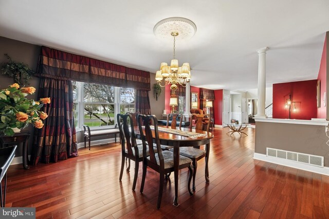6 Keystone Way, Princeton Junction, NJ 08550 - dining space with a chandelier, ornate columns, wood-type flooring, and baseboards